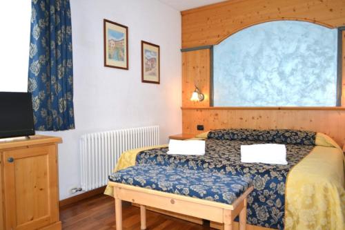 Postel nebo postele na pokoji v ubytování Hotel Corona