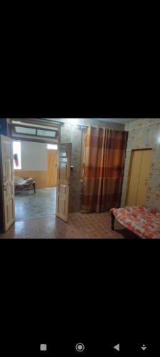 a room with two bunk beds and a bed sidx sidx sidx sidx at WanderNest BirmiGali in Abbottābād