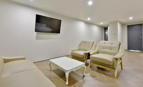 Гостиная зона в Brown Dot Hotel Minam