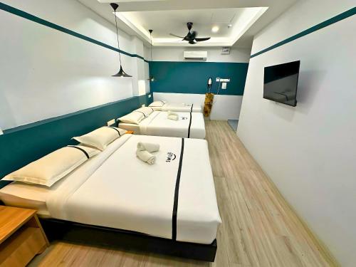Postel nebo postele na pokoji v ubytování Smile Hotel Balakong Kajang