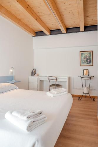 Postel nebo postele na pokoji v ubytování Agriturismo Fattoria Ortoalpino