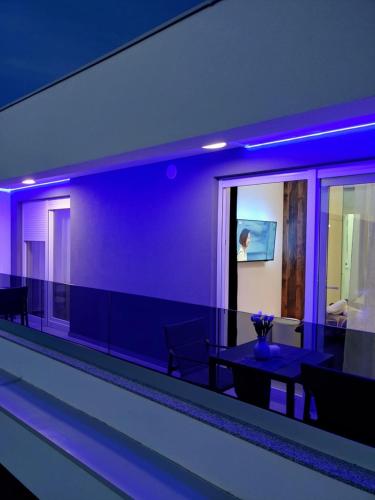 a room with blue lights in a building at Bella Vista Sunset penthouse with private jacuzzi in Novalja