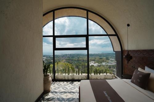 Ένα ή περισσότερα κρεβάτια σε δωμάτιο στο Sunny Samudra Boutique hotel Uluwatu