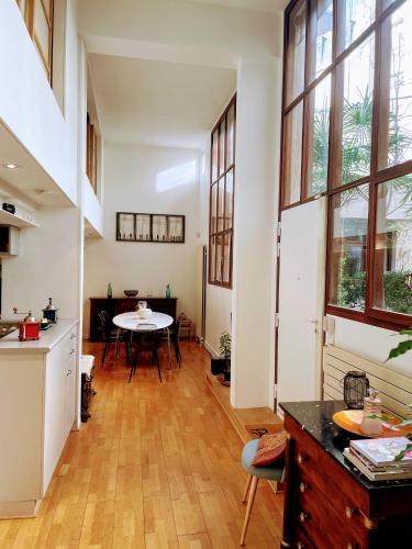 Loft with view on a quiet garden, Parisian Charm