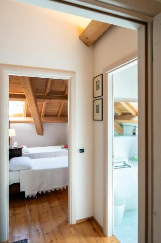 Postel nebo postele na pokoji v ubytování Agriturismo Fattoria Ortoalpino