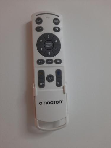 a remote control hanging on a wall at Appart avec loggia en front de mer et superbe vue in Le Barcarès