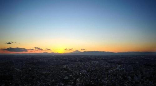 a view of a city with the sunset in the background at Yokohama Royal Park Hotel in Yokohama