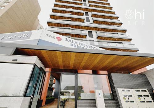 a building with a sign on top of it at Suite de Lujo Frente al Mar Full amoblada in Lima