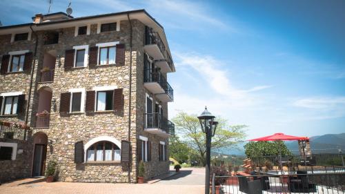 a building with a street light in front of it at Antiche Terre Hotel & Relax in Pignone