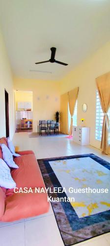 a living room with a couch and a ceiling at CASA NAYLEEA Guesthouse Kuantan in Kuantan