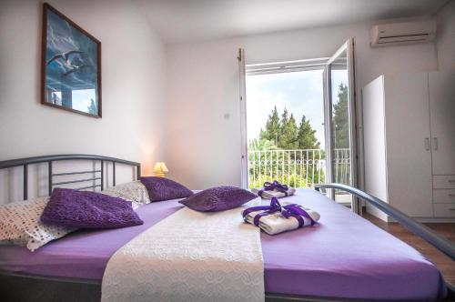 Ένα ή περισσότερα κρεβάτια σε δωμάτιο στο Apartments Srijemsi