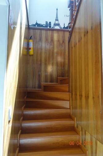 a set of stairs in a building with the eiffel tower at Hotel Maceo 55 - Colonial Inn in Bogotá