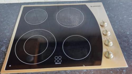 a close up of a microwave with four dials at 3-bedroom penthouse in Larnaka