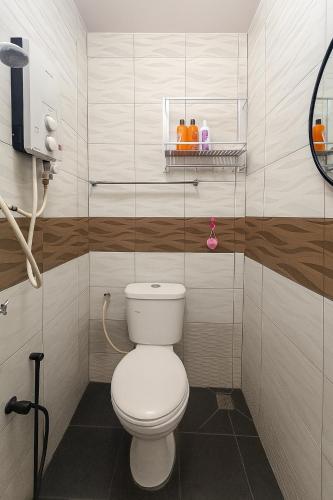 a bathroom with a white toilet in a room at 3133 Heritage Home in George Town