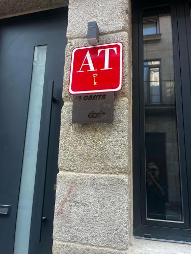 a no entry sign on the side of a building at La casita by DADO in Vigo