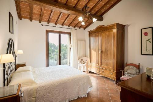 Agriturismo I Rosetiにあるベッド