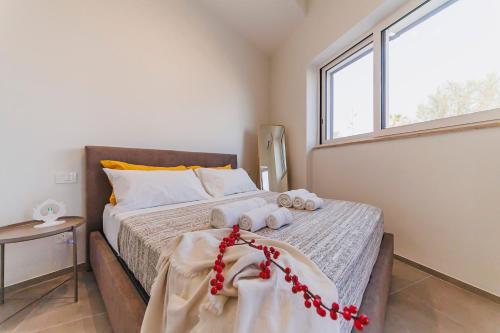 Postel nebo postele na pokoji v ubytování DIMORA CATERINA - Suite Apartments & Sea View