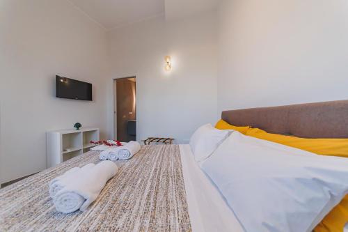 Postel nebo postele na pokoji v ubytování DIMORA CATERINA - Suite Apartments & Sea View