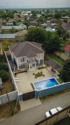 an aerial view of a house with a swimming pool at Rest Paradise Villa Gabala in Gabala