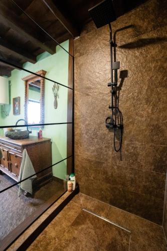 a bathroom with a shower and a sink at Házikó Balatonalmádi in Balatonalmádi