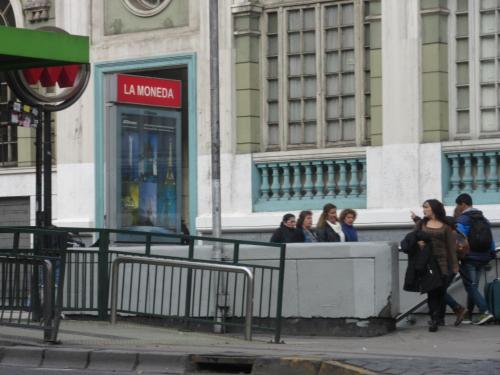 a group of people walking in front of a building at Departamento Paseo Bulnes Metro La Moneda in Santiago