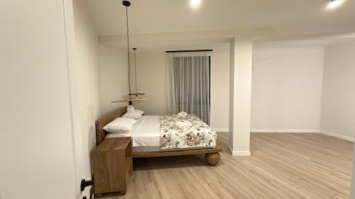 a bedroom with a bed in a room at Kvariati House in Kvariati