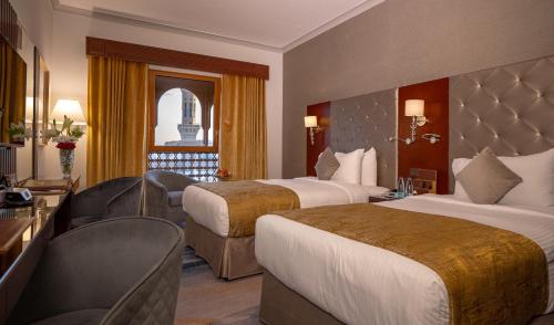 Un ou plusieurs lits dans un hébergement de l'établissement Dar Al Taqwa Hotel