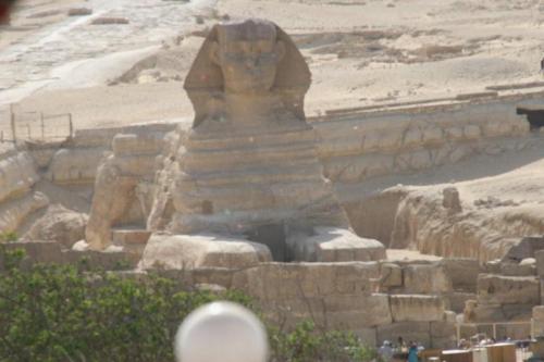 a large statue in the middle of the desert at Pyramids View Inn in Cairo