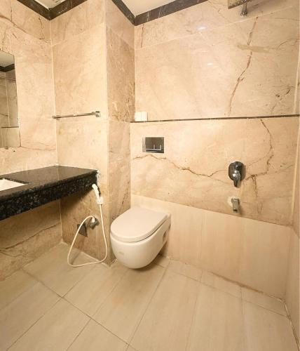 a bathroom with a toilet and a sink at BUDDHA HERITAGE RESORT in Bodh Gaya