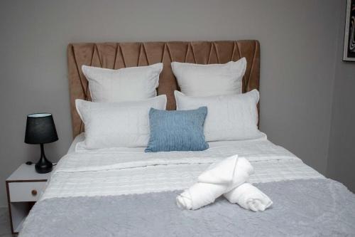 Voodi või voodid majutusasutuse City Escape Apartments toas