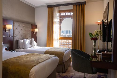 Un ou plusieurs lits dans un hébergement de l'établissement Dar Al Taqwa Hotel