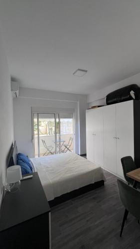 Llit o llits en una habitació de Tommy Apartment