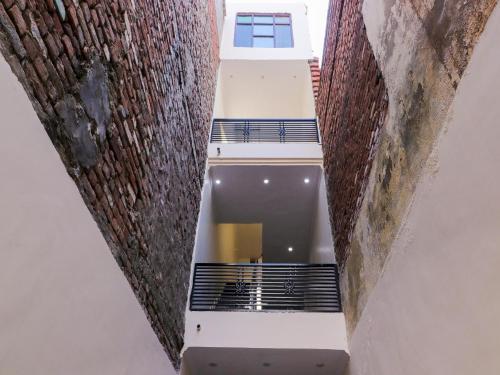 a staircase leading to the second floor of a building at Hotel O Hc Plaza in Kharar