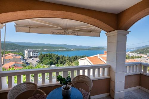 a balcony with a view of a lake at Apartmani Bonaca Neum in Neum