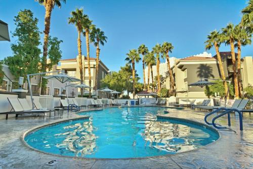 a pool at a resort with palm trees at Wyndham Desert Rose Resort 1BR Apartment with Resort Access in Las Vegas