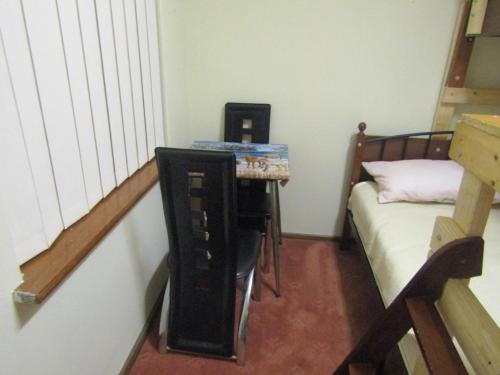 Ένα ή περισσότερα κρεβάτια σε δωμάτιο στο Santa lodge