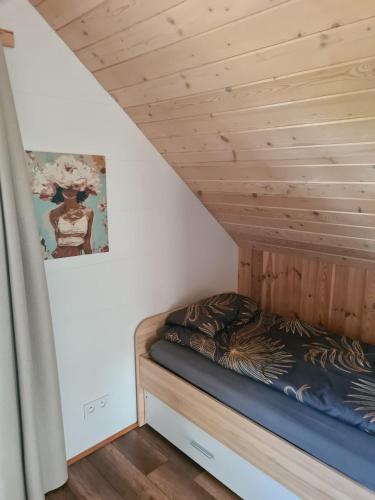 Postel nebo postele na pokoji v ubytování Domek nad Zalewem