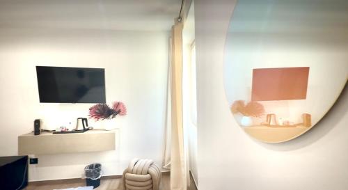 Televisyen dan/atau pusat hiburan di Su Entu Guest House