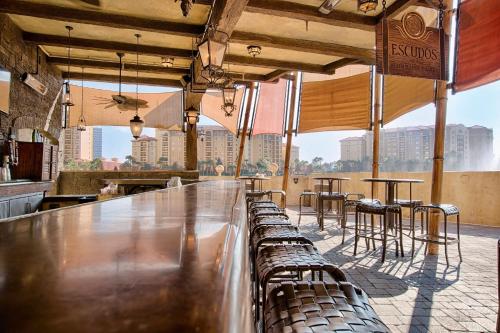 a bar with chairs and tables in a building at Wyndham Bonnet Creek 1BR Apartment with Resort Access in Orlando