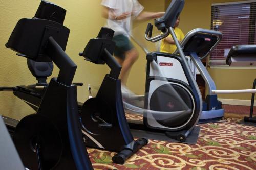 a person riding an exercise bike on a treadmill at Wyndham Bonnet Creek 2BR Apartment with Resort Access in Orlando