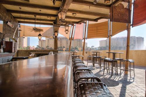 a bar with chairs and tables in a restaurant at Wyndham Bonnet Creek 2BR Apartment with Resort Access in Orlando