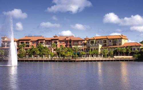 a building with a fountain in the middle of a body of water at Wyndham Bonnet Creek 3BR Apartment with Resort Access in Orlando