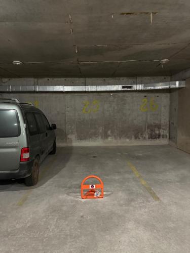 a parking garage with a car parked in it at Infinity Terrace 1BR Apartment Nessebar in Nesebar