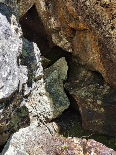 a group of rocks with a hole in them at Beautiful place among forests and fields in a good old style in Eggedal