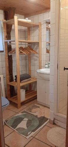 a bathroom with a sink and a tub at la Fleur du MàS in Sablières