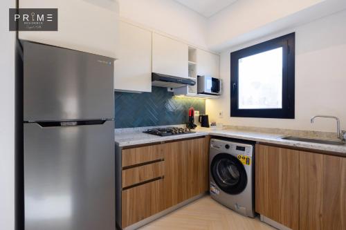 Una cocina o cocineta en Prime Residence Zayed Hills