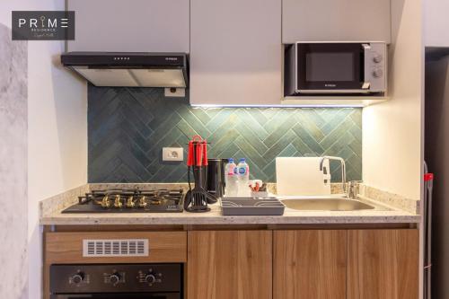 Una cocina o cocineta en Prime Residence Zayed Hills