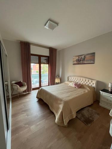 a bedroom with a bed and a window at Isabel BGY house airport in Grassobbio