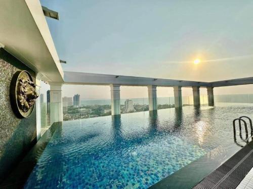 a swimming pool on the roof of a building at Skyline Stay - Empire Tower in Jomtien Beach