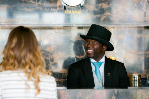 a man wearing a top hat and a woman at Jannah Burj Al Sarab in Abu Dhabi